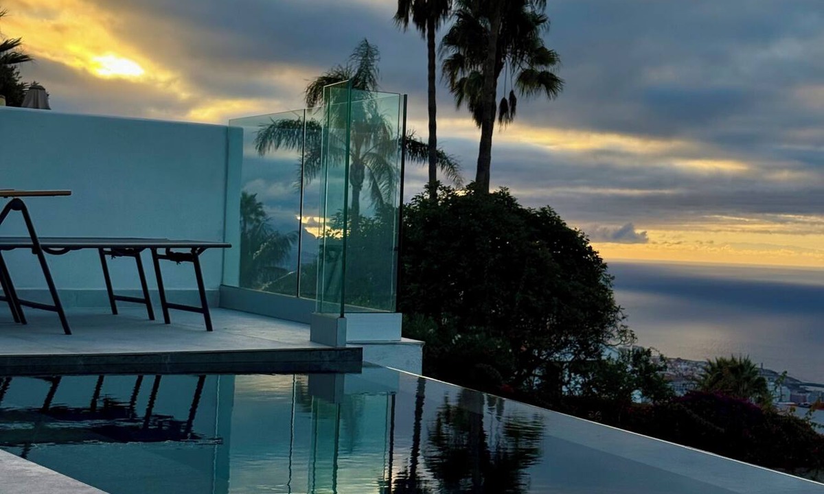 Las Cuevas Ski Chalet | White House Relaxation, Views, and an Infinity Pool