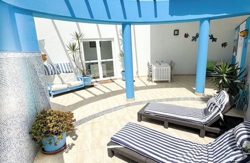 Geafond House | Sunny Corralejo villa with pool & sunroof ocean views. A sun trap. sleeps 4